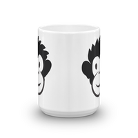 white mug with black and white Monkey Monk face on sides, view shows front edge with both faces visible
